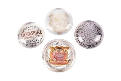 Lot 312 - Four glass advertising paperweights
