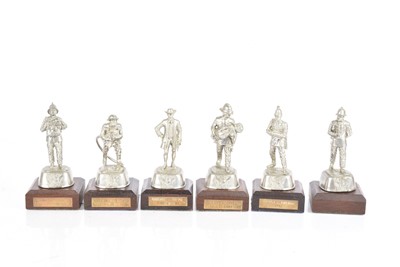 Lot 51 - A group of six white metal Fireman Figures by Charles Staddon
