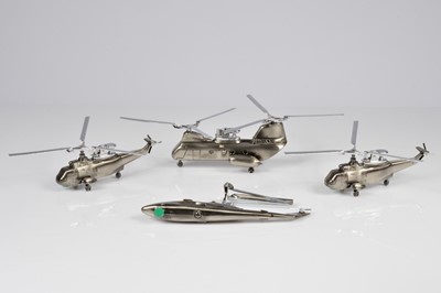 Lot 236 - Four novelty Helicopter table lighters
