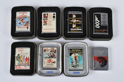 Lot 264 - A set of eight 1996 James Bond Film Zippo Lighters