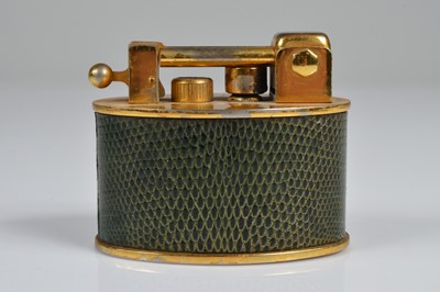 Lot 268 - A Gubelin petrol table lighter