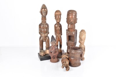 Lot 324 - A selection of Male and Female African Carved Figures