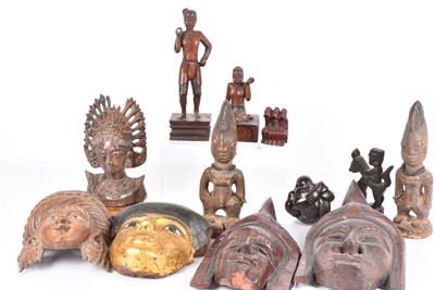 Lot 327 - A collection of various African carved wooden items