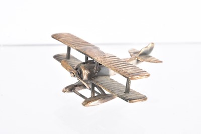 Lot 407 - A miniature silver figure of a Sopwith Biplane