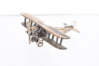 Lot 408 - A miniature silver figure of a Spad Biplane