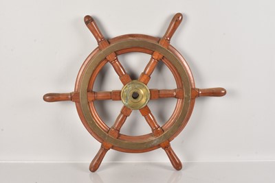 Lot 431 - A small mahogany and brass ship's wheel