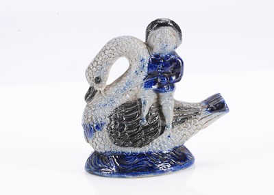 Lot 291 - An 19th century German stoneware boy riding a swan bird whistle