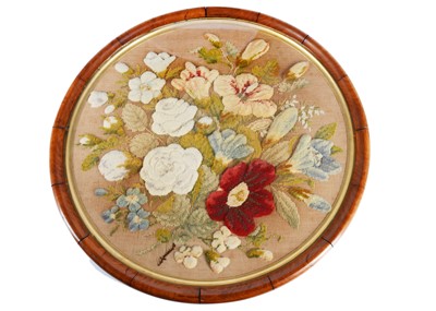 Lot 299 - A large circular wool-work floral picture