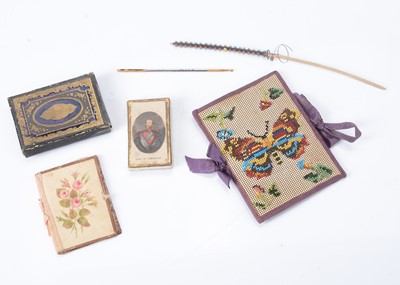 Lot 352 - An 19th century beadwork on paper needle case depicting a butterfly