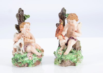 Lot 379 - A pair of Derby porcelain seated cherubs from a series of senses, circa 1780