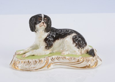 Lot 386 - An English porcelain lying spaniel, circa 1835
