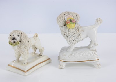 Lot 388 - Two Staffordshire white poodles with baskets in mouths, 1835-45