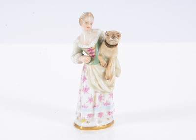 Lot 399 - A late 19th century Meissen scent bottle of a lady holding a pug
