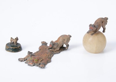 Lot 409 - Three metal pug dogs