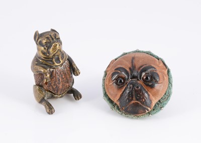 Lot 410 - A carved wooden pug dog face pincushion