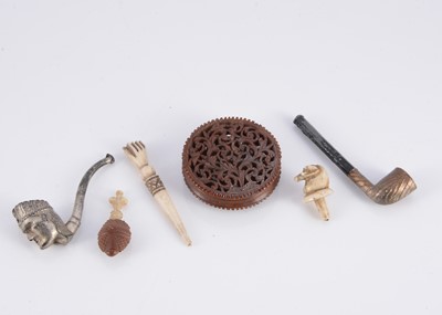 Lot 423 - An 19th century intricately carved and pierced nut circular box