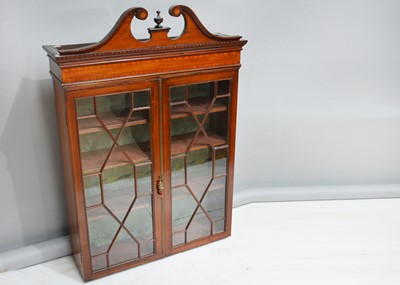 Lot 451 - An Edwardian mahogany inlaid display cabinet