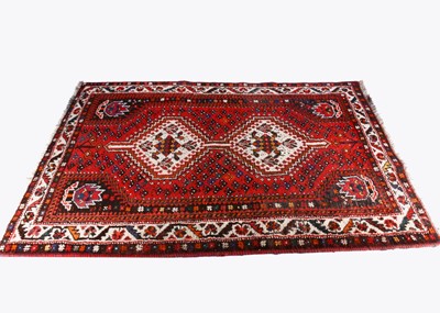 Lot 454 - An early 20th century Shiraz woollen hand knotted rug
