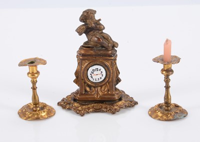 Lot 579 - A German gilt metal dolls’ house mantel clock