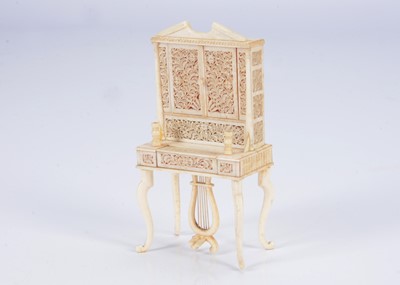 Lot 580 - A rare 19th century bone doll’s house pianola cabinet