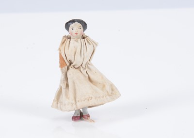 Lot 587 - An 19th century German ‘alien head’ small dolls’ house doll