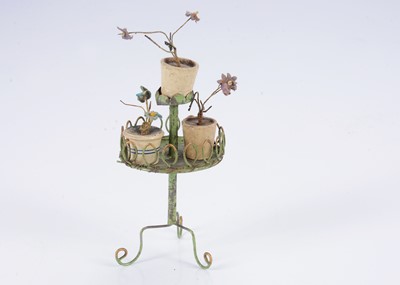 Lot 590 - A German painted tinplate dolls’ house plant stand