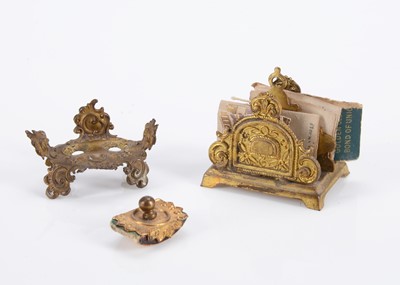 Lot 594 - German gilt metal dolls’ house desk accessories