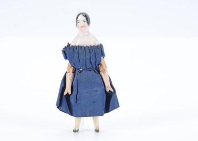 Lot 599 - A rare mid 19th century German china shoulder head small dolls’ house doll
