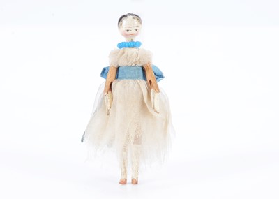 Lot 601 - An 19th century Grodnertal carved wooden small dolls’ house doll