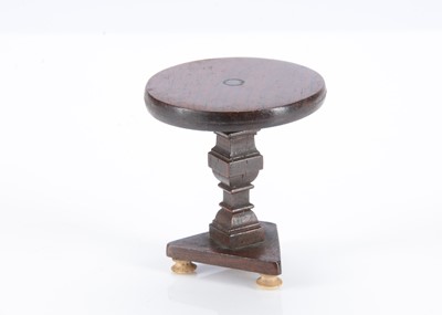 Lot 602 - An 19th century English carved wooden small dolls’ house occasional table