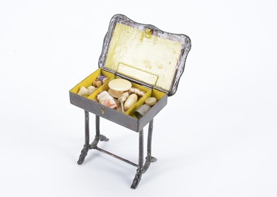 Lot 603 - An 19th century Rock & Graner painted tinplate dolls’ house sewing table