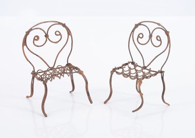 Lot 608 - Two 19th century German wire dolls’ house garden chairs
