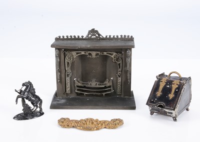 Lot 610 - An 19th century tinplate dolls’ house fireplace
