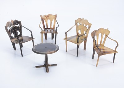Lot 612 - Four horn dolls’ house chairs