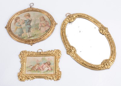 Lot 614 - Two late 19th century gilt metal pictures and a mirror