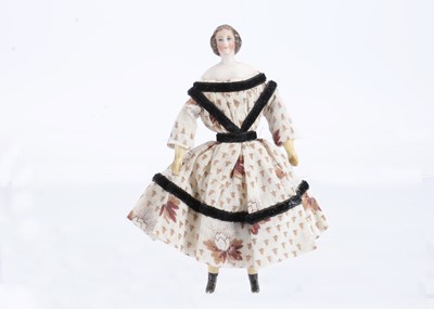 Lot 621 - An 19th century German bisque shoulder-head dolls’ house doll