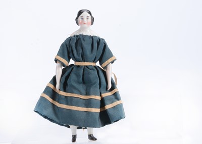 Lot 623 - An 19th century German china shoulder-head larger scale dolls’ house doll