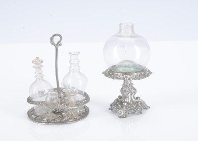 Lot 629 - A German soft metal dolls’ house decanter stand