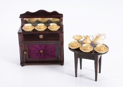 Lot 630 - Two 19th century pieces of Waltershausen dolls’ house furniture and a turned wooden tea set