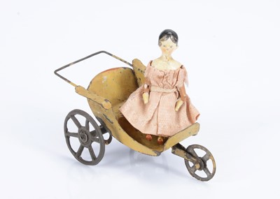 Lot 648 - An 19th century Grodnertal carved wooden small dolls’ house doll
