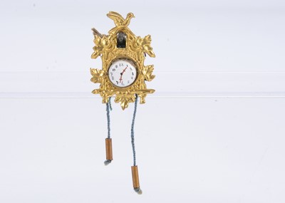 Lot 665 - An late 19th century German gilt metal cuckoo clock