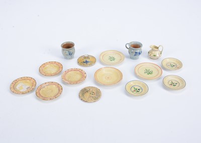 Lot 669 - An 19th century turned wooden and painted dolls’ house plates and vessels