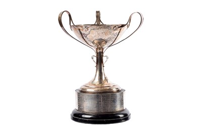 Lot 9 - An arts and crafts Edward VII three handled cup