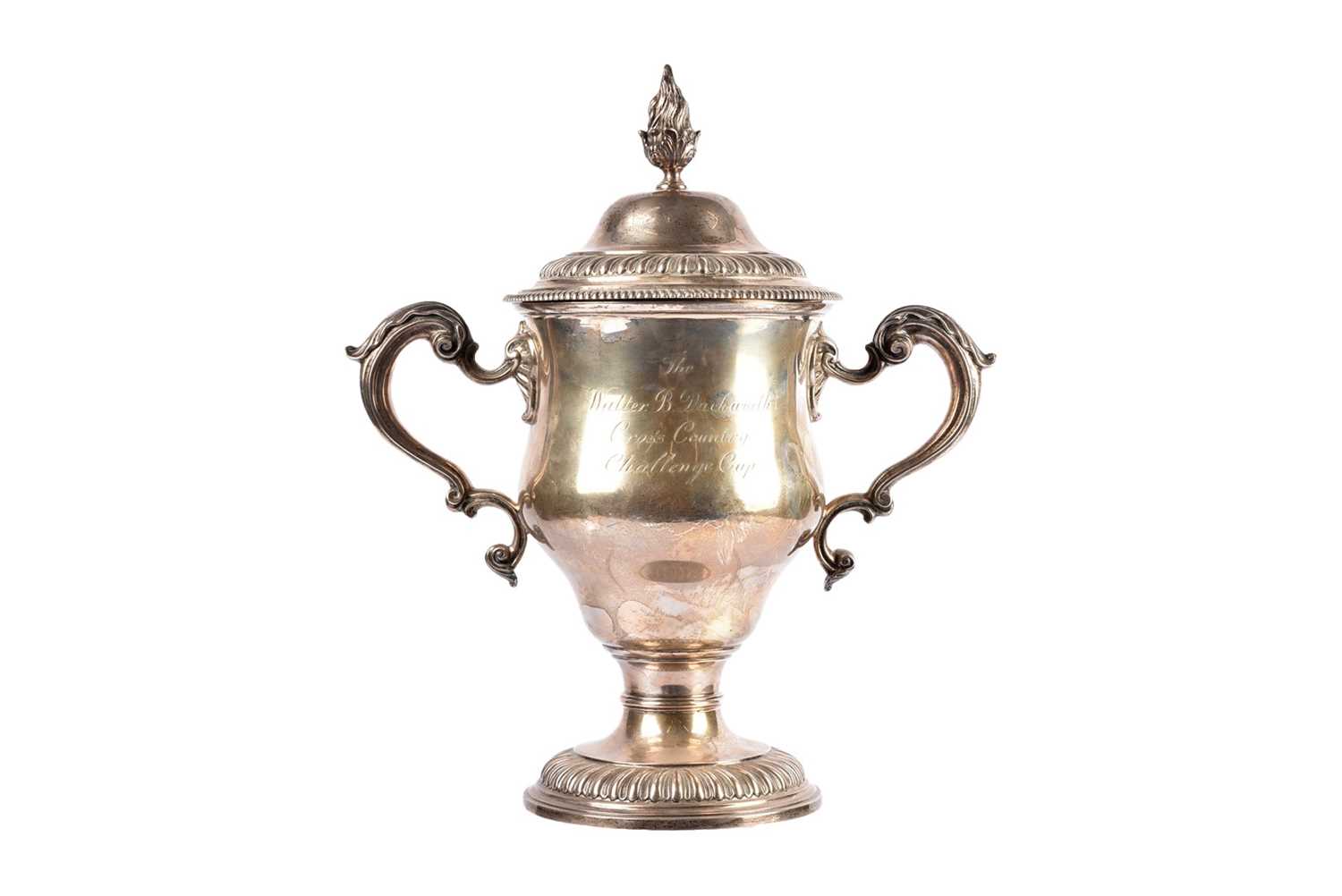 Lot 14 - A George V silver twin handled presentation trophy and cover