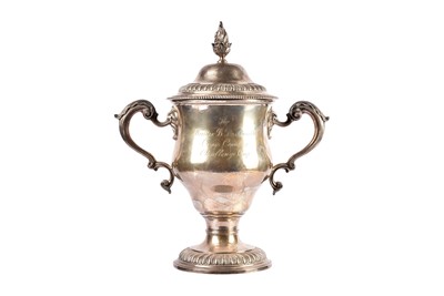 Lot 14 - A George V silver twin handled presentation trophy and cover