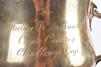 Lot 14 - A George V silver twin handled presentation trophy and cover