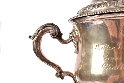 Lot 14 - A George V silver twin handled presentation trophy and cover