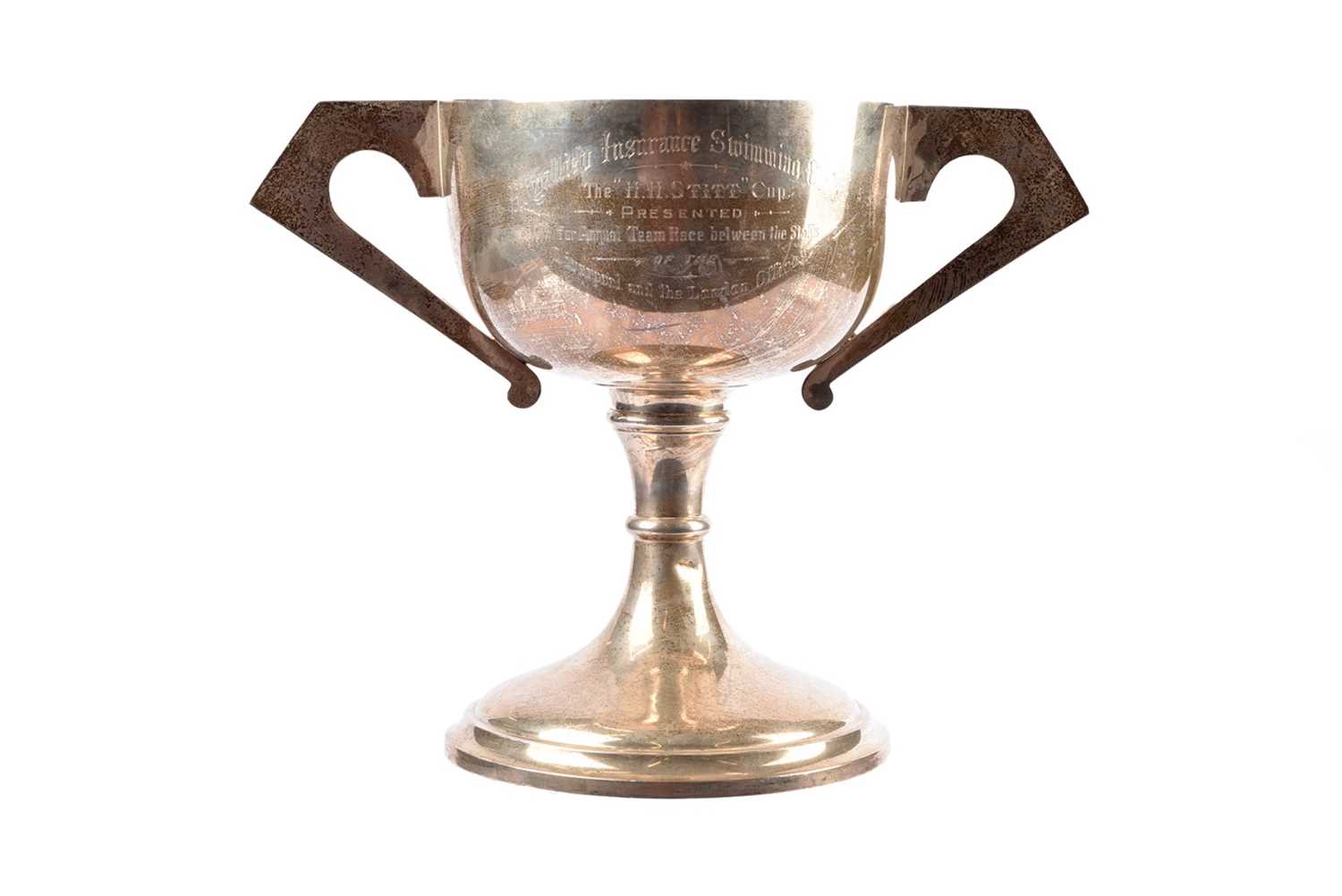 Lot 20 - A George V art deco silver presentation twin handled cup