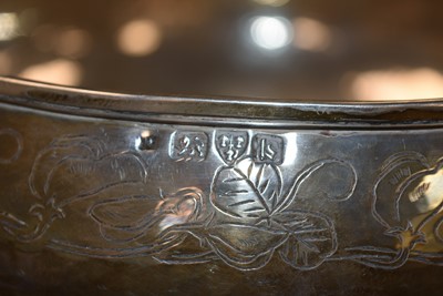 Lot 22 - A George V arts and crafts silver footed rose bowl