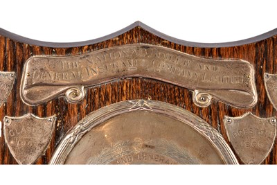 Lot 31 - A silver and oak presentation shield trophy